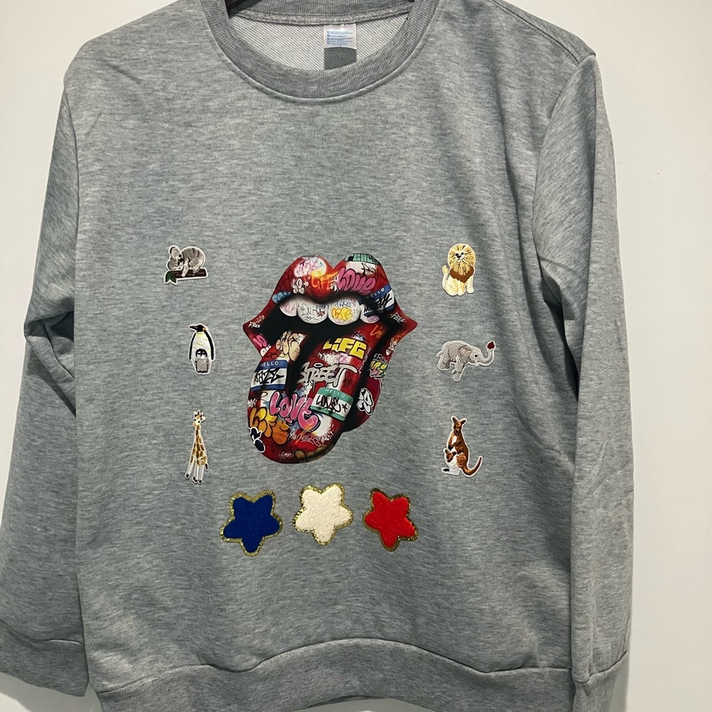 Men’s “ CRAZY SHIRT”.   NWOT.  Lots of artwork.